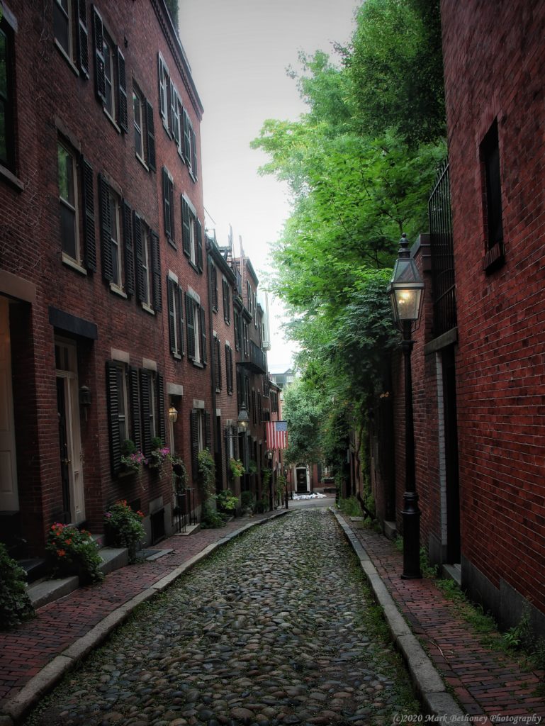 Moody Boston cobblestone lined street.