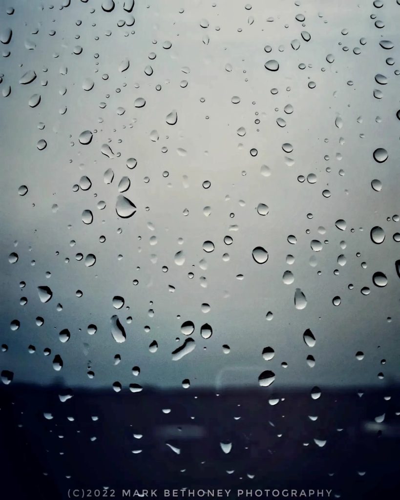 Raindrops on window pane.